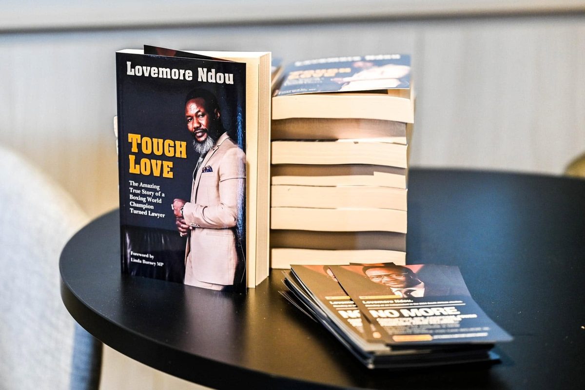 Copies of Tough Love, the memoir by Lovemore Ndou, on a table